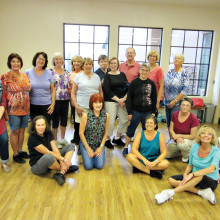 Thursdays in the MountainView aerobics room are a busy time. Here are the smiling faces of the highest level group of line dancers with Rebecca Magdanz (SaddleBrooke Line Dance Instructor). There are three skill levels and these folks are the creme de la crème.