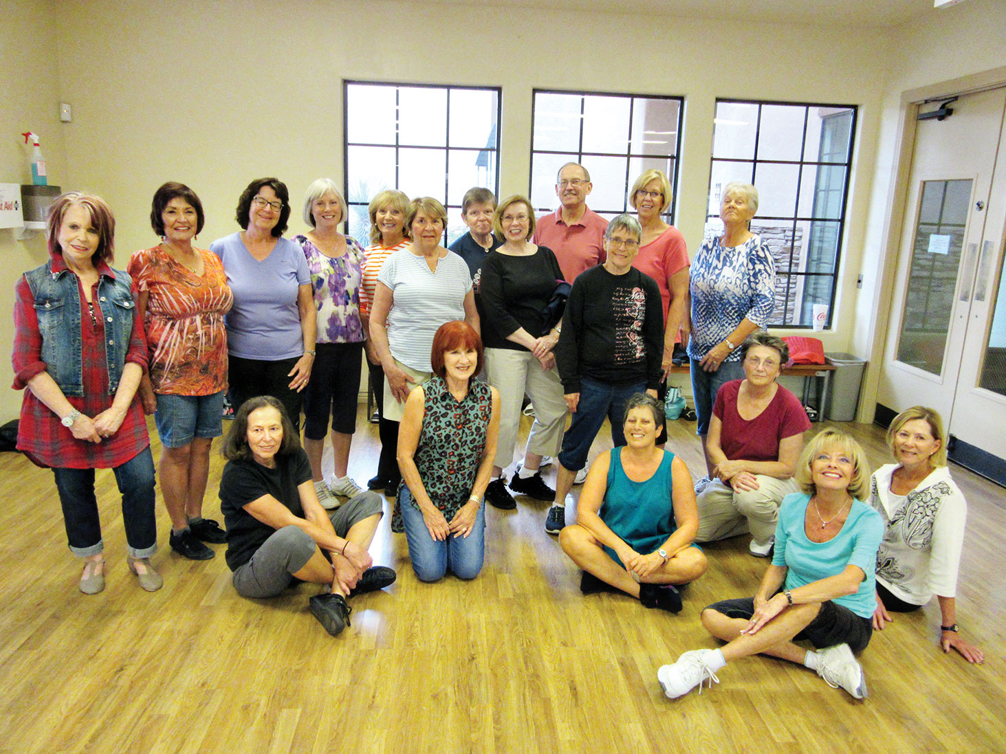 Thursdays in the MountainView aerobics room are a busy time. Here are the smiling faces of the highest level group of line dancers with Rebecca Magdanz (SaddleBrooke Line Dance Instructor). There are three skill levels and these folks are the creme de la crème.