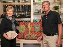 Susan and Jerry Gustafson display the craftsmanship available at the SaddleBrooke Gift Shop.