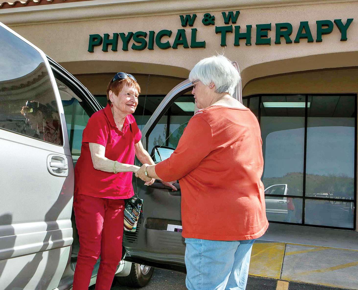 Senior Village volunteer drives member to physical therapy.