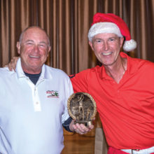 Left to right: Mike Harris receiving trophy from interim Tournament Director Mick Borm
