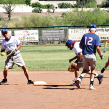 Recreation League: Charles Hendryx tags second base and is ready to make the throw to first for a double play; photo by Jim Smith.