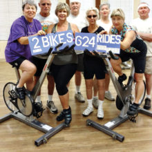 Left to right: Joan Elder, Bill Powell, Johanna Pawelczyk, Frances Adams, Susie Proust, Phoebe Bax, Linda Wilsber, and Roger Phillips. Two bikes = 624 rides per year.