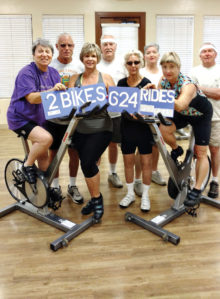 Left to right: Joan Elder, Bill Powell, Johanna Pawelczyk, Frances Adams, Susie Proust, Phoebe Bax, Linda Wilsber, and Roger Phillips. Two bikes = 624 rides per year.