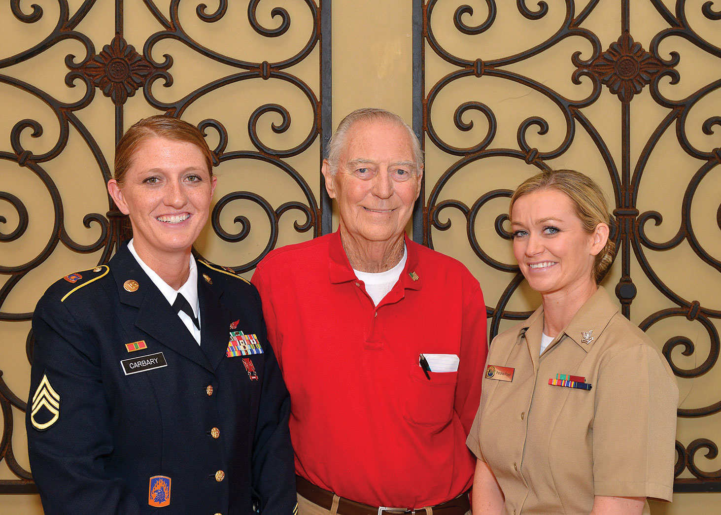 Left to right: Staff Sergeant Jamie Carbary, US Army; George Bidwell, President SaddleBrooke Troop Support and Petty Officer 2nd Class Porchea Geiger, US Navy visit Ladies Day Out.