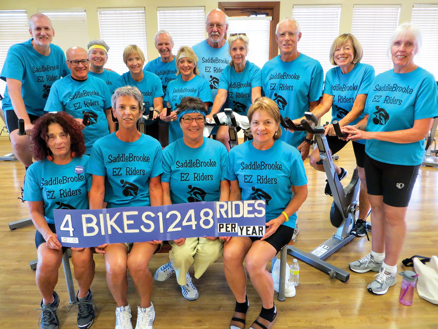 SaddleBrooke EZ Riders riding to four bikes and 1248 riders per year! Front: Elisa Hauptman, Fran Weinberg, Ruth Leman and Jean Lillis; back: Dave Palmeri, Dale leman, Phoebe Bax, Linda Wilberg, Ron Reagan, Cheryl Mundy, Paul Swane, Susie Proust, Bill Powell, Marje Valenti and Suzanne Reagan; photo by Jim Ryan