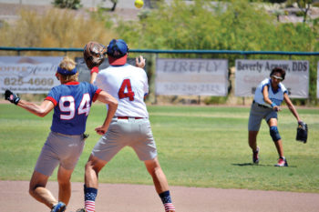 Debbie Seguin’s throw to Paul Butler (4) is not in time as Mary Schneck (94) pulls into second base.