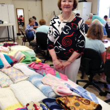 Eileen Bartsch has knitted many baby items that go to Family First.