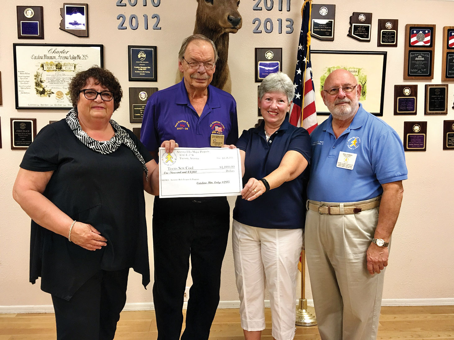 Sig Danielson, Exalted Ruler of the Catalina Mountain Elks Lodge No. 2815 and Ira Cohen, Arizona Elks Major Projects Coordinator present a check for $1,000 to Teens Sew Cool President Linda Shannon-Hills and Executive Liaison Kathleen Morgan Squires.