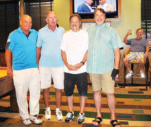 Left to right: Bruce Fink second place, Larry Tipton fourth place, Paul “Bankster” Callas first place, Tom “Half Jacket” Barrett third place. Lurking in the background is Dominic “The Doctor” Borland sitting in his very familiar chair.