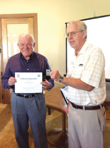 Certificate of Appreciation and MOAA Coin presented to Captain Melvin from Colonel Benedict, president