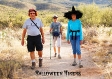 Halloween hikers are Michael Reale, Rainie Warner and Jan Springer; photo by Barbara Wilder