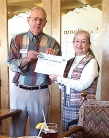 Captain Lorna Fairchild receives a Certificate of Appreciation from the MOAA.