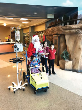Santa (Fred Barazani) accompanied the carolers and pleasantly surprised children at Diamond Children’s Hospital.