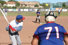 This could be you--but you are watching as Jack Graef keeps his eyes on the pitch. Notice the pitching screen for added safety; photo by Jim Smith.