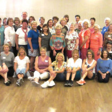 SaddleBrooke community line dancers take a photo break at the March 18 Line Dance with Rebecca spring fundraiser dance.