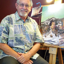 Fred Flanagan pauses in his studio with an in-progress work, Buffalo Mist.
