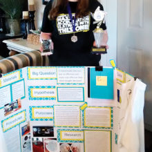 Elena Hendrix with her project board and all her awards