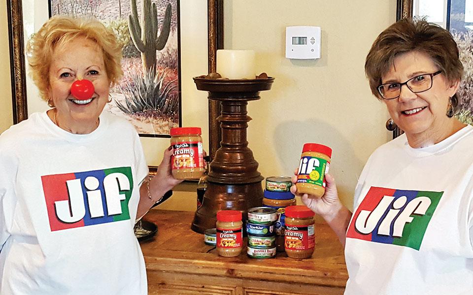 Savo Fries and Patti Albaugh sport Jif Peanut Butter shirts as a reminder of the Protein for Growing Minds project. Savo Fries, never one to miss an opportunity for humor, has a clown nose to commemorate Red Nose Day, a nonprofit activity to help disadvantaged children.
