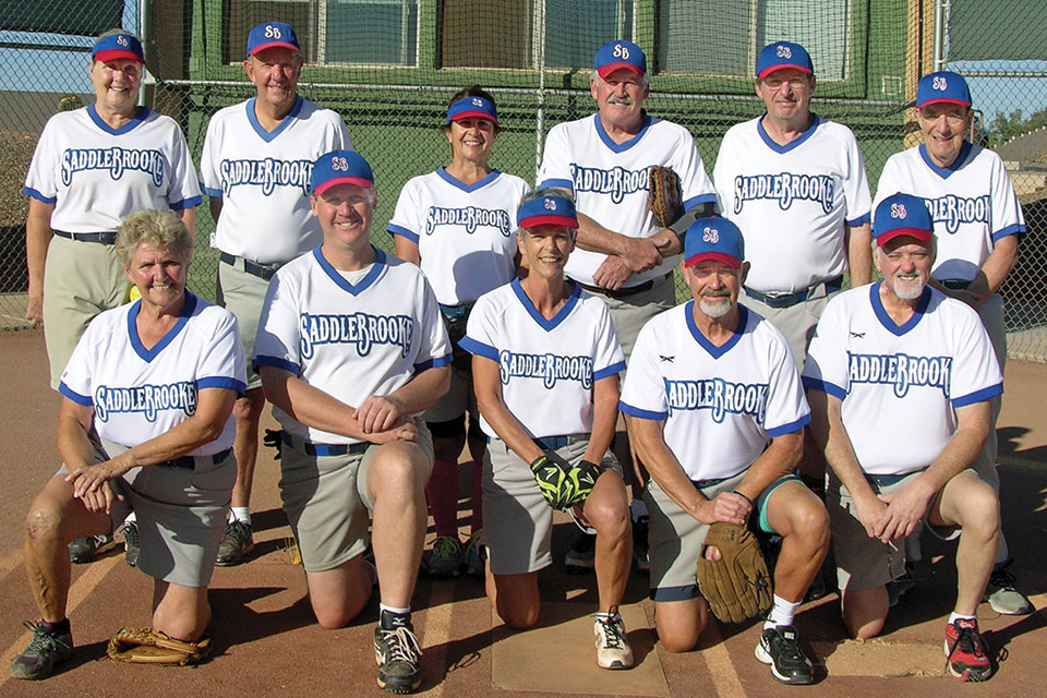 John’s spring season teammates. For those who wonder if ladies play softball, please note there are four ladies on this team; add one more that was missing on photo day; photo by Pat Tiefenbach.