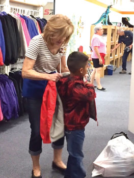 At Kids’ Closet, a volunteer “personal shopper” assists every child.