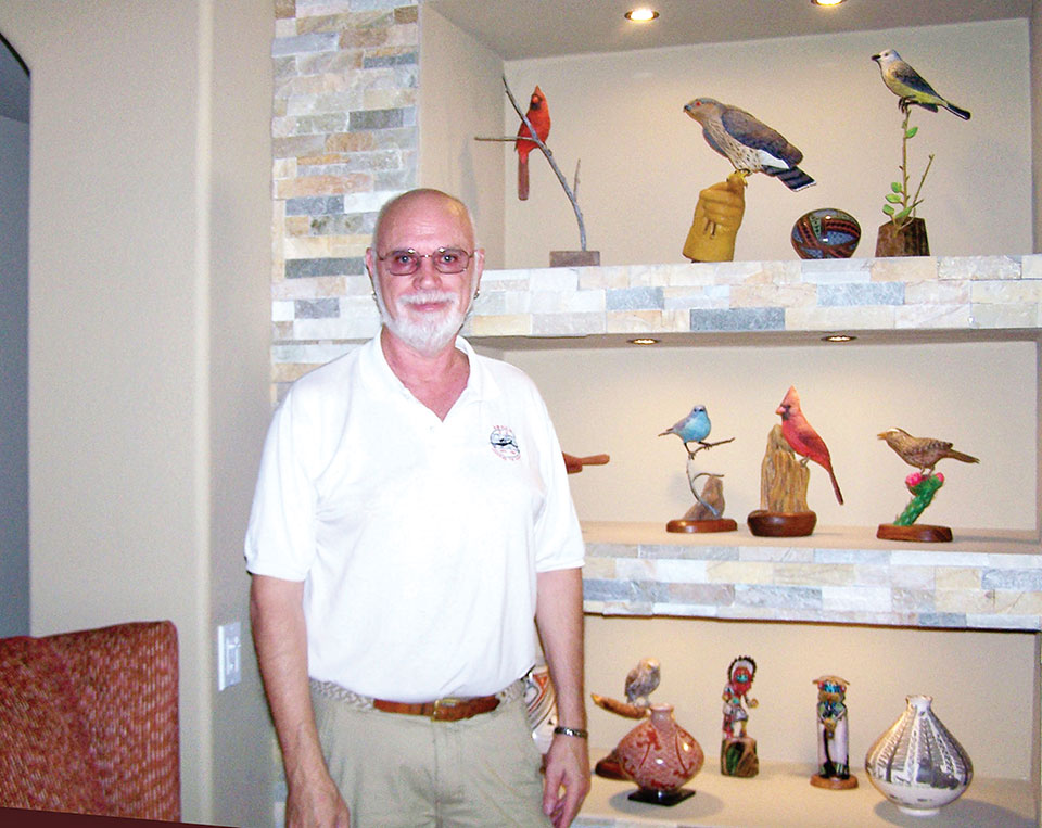 Mark Erickson with some of his beautiful birds