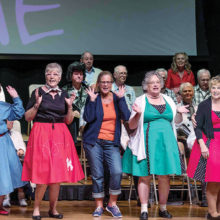 Some Singers hamming it up at their ‘50s Medley Melee Spring Concert; photo by Bill George