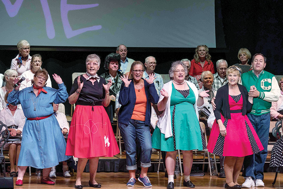Some Singers hamming it up at their ‘50s Medley Melee Spring Concert; photo by Bill George