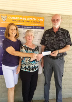 Marcia Schima and Mark Erickson present check to Darlene Cavanaugh (Oracle’s Mountain Vista K-8 school librarian).