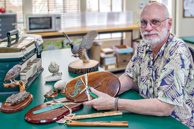Mark Erickson with many of his handcrafted works. Photo by Russell C. Stokes.