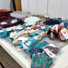 Just look at the collection of items donated to Senior Village. Thanks, knitters!