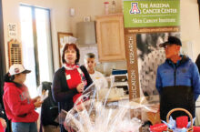 TJ Duffy and Denise Spartonos with Gary Rowell.