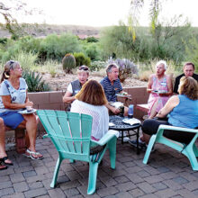 Enjoying the evening on the Branstrom patio. Photo by Ron Talbot.