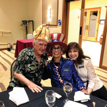 Fred "Turkey" Barazani, who forgot to wear a costume; Bonnie Barazani, looking madder than a hatter in her July 4 costume; and Deborah Adinolfi, somehow still looking glamorous and poised as she tries to keep Fred and Bonnie in line.