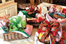 Colorful holiday baskets, prepared by Senior Village volunteers, await delivery thanks to donations to the Village Gift Fund.