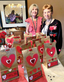 Sandy Valenzuela and Gerry Burnside with Valentine’s goodie bags.