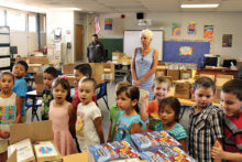 There is so much joy and excitement in the eyes of the children as they look at the books they will receive.