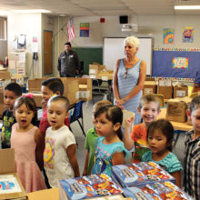 There is so much joy and excitement in the eyes of the children as they look at the books they will receive.