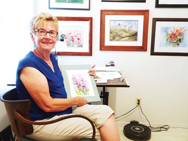 Sue Wilson shows a watercolor she completed in an online class during our stay-at-home season.