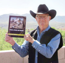 Stuart Watkins with his book