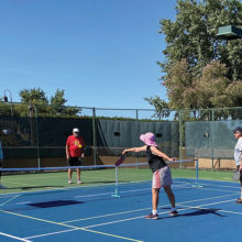 Dan Linegar and Doug Boklund warming up for a game with Linda and Donald Cornish