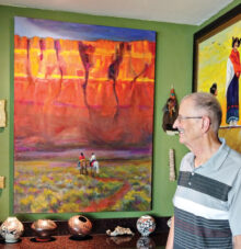 David Thekan pauses in front of Navajos at Vermillion Cliffs. (Photo by LaVerne Kyriss)