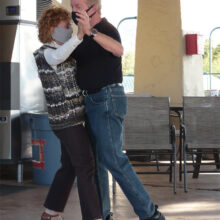 Wanda Ross, SBDC Secretary, and Bob Osborne dance a tango.