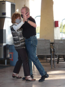 Wanda Ross, SBDC Secretary, and Bob Osborne dance a tango.