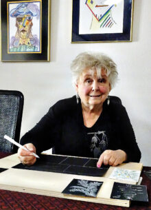 Leslie Farber works on creating hand-painted Christmas cards for family and close friends. (Photo by LaVerne Kyriss)