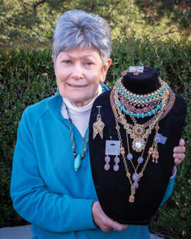 Dorothy displaying samples of her handcrafted jewelry (Photo by Russell C. Stokes)