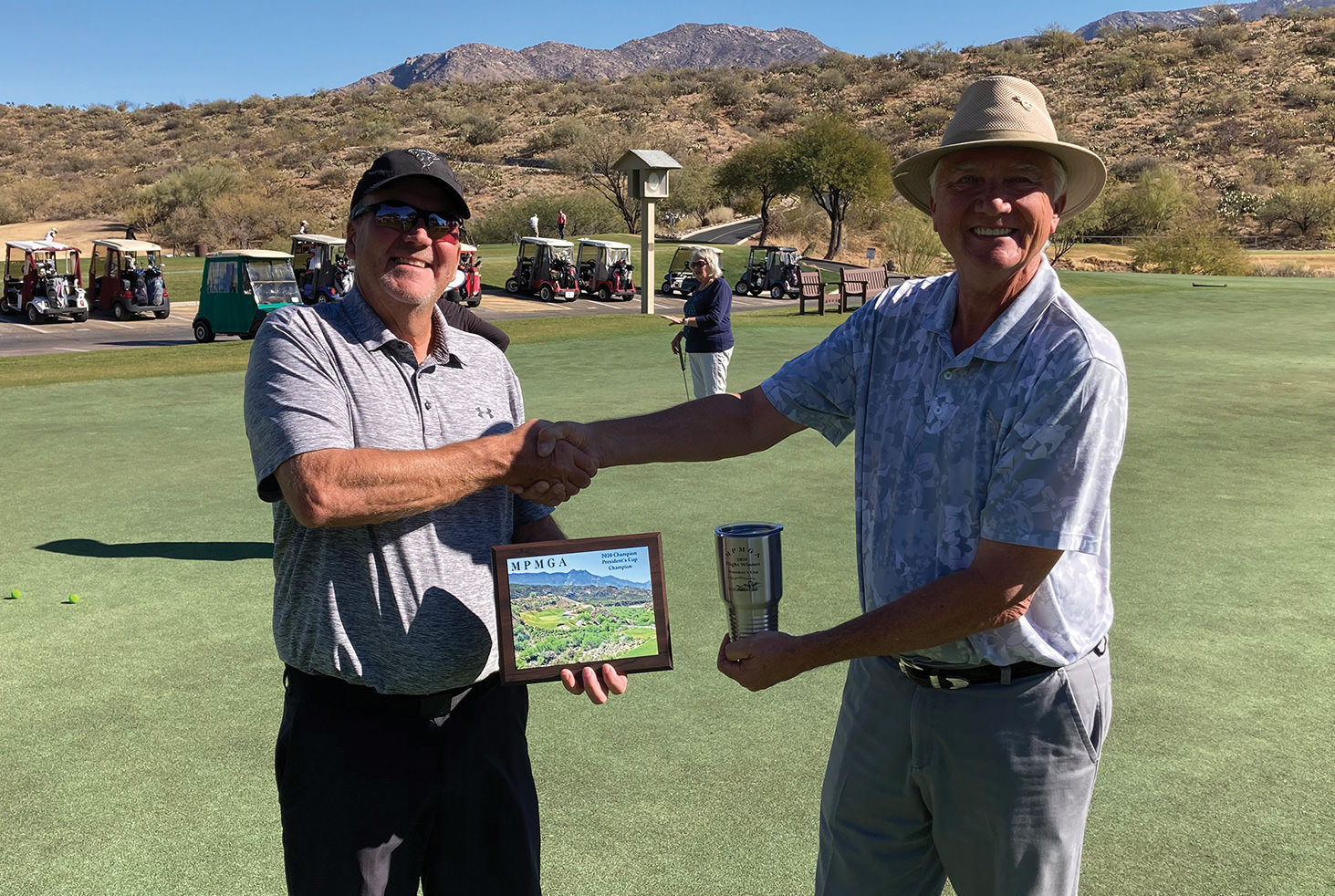 Lee Leksell (left) is congratulated by Dan Nordhill, MPMGA president, on winning the 2020 President’s Cup.