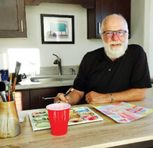 Carl Saulsbury sits in his casita studio. (Photo by LaVerne Kyriss)