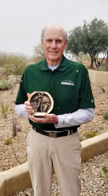 Dave Harmon captures the trophy for the Tournament of Champions.