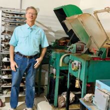 Dave Lancaster in his garage with rock saws (Photo by Judy Lancaster)